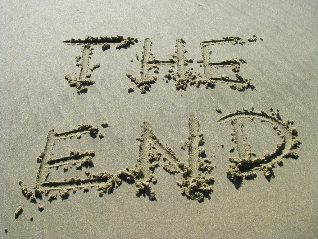 A sandy beach with the capital letters dug in spelling the end A sandy beach with the capital letters dug in spelling the end