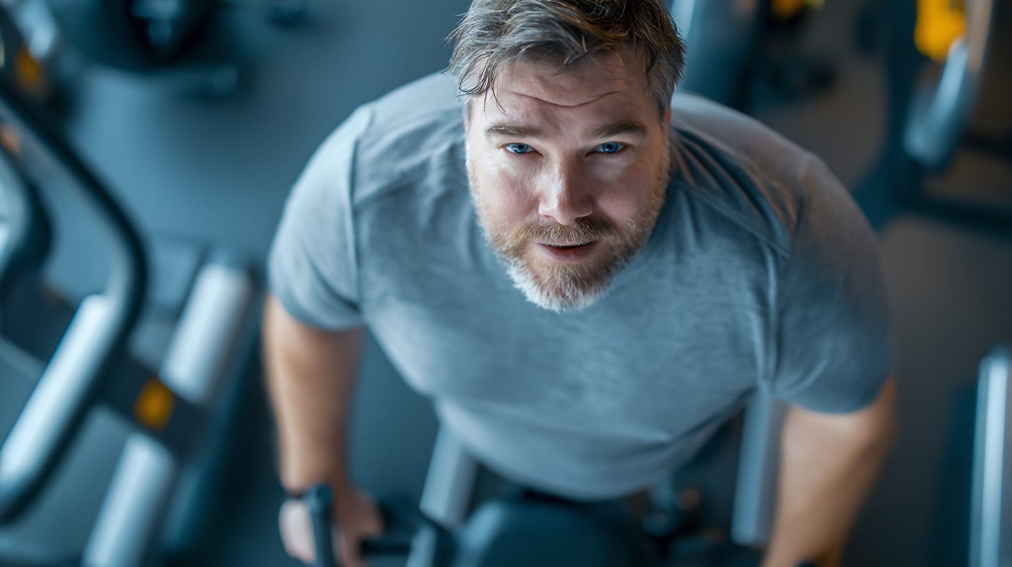 Obese man exercising in the gym.  Obese man exercising in the gym.