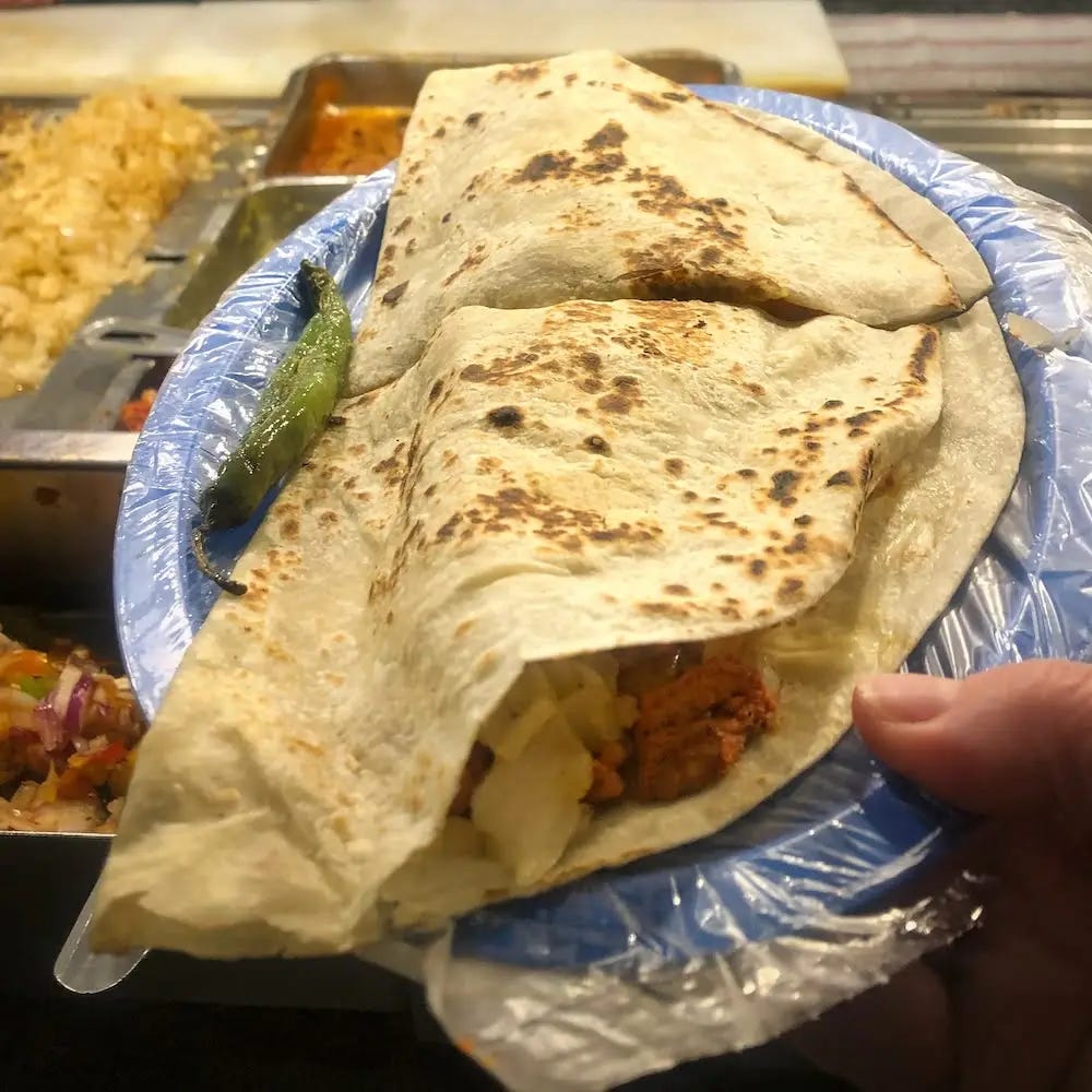 A large quesadilla cut in half