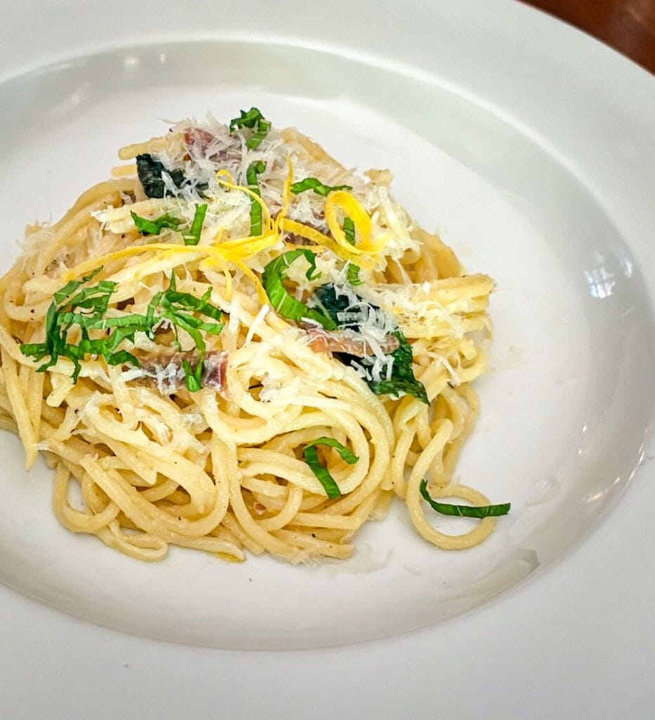This image has an empty alt attribute; its file name is Spaghetti-with-Anchovies-Lemon-Mint-and-Pecorino-Romano-1-932x1024.jpeg