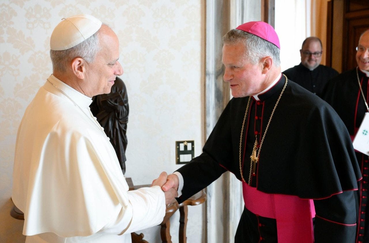 Pope Leo XIV shakes hands with Archbishop Timothy Broglio Pope Leo XIV shakes hands with Archbishop Timothy Broglio