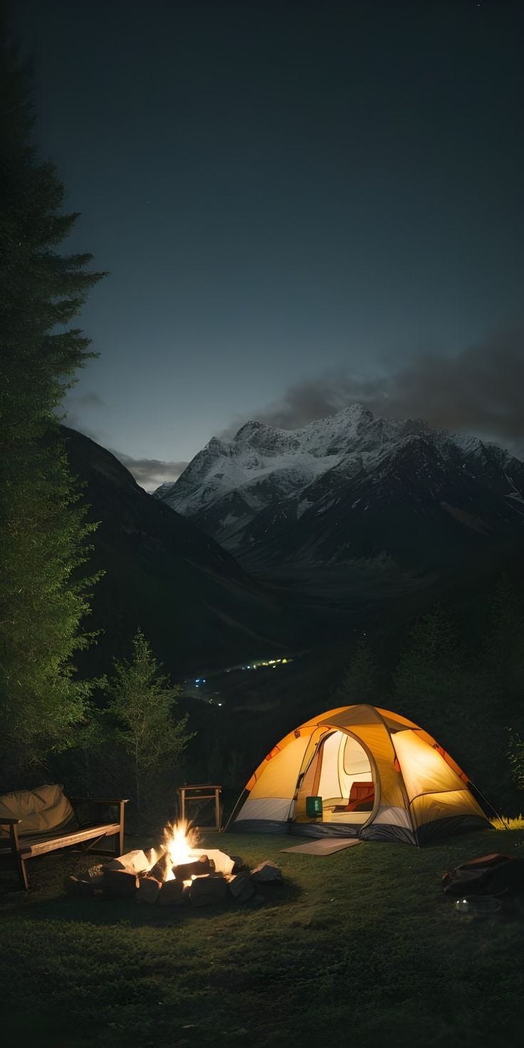 This may contain: a tent set up in the middle of a field at night with a campfire