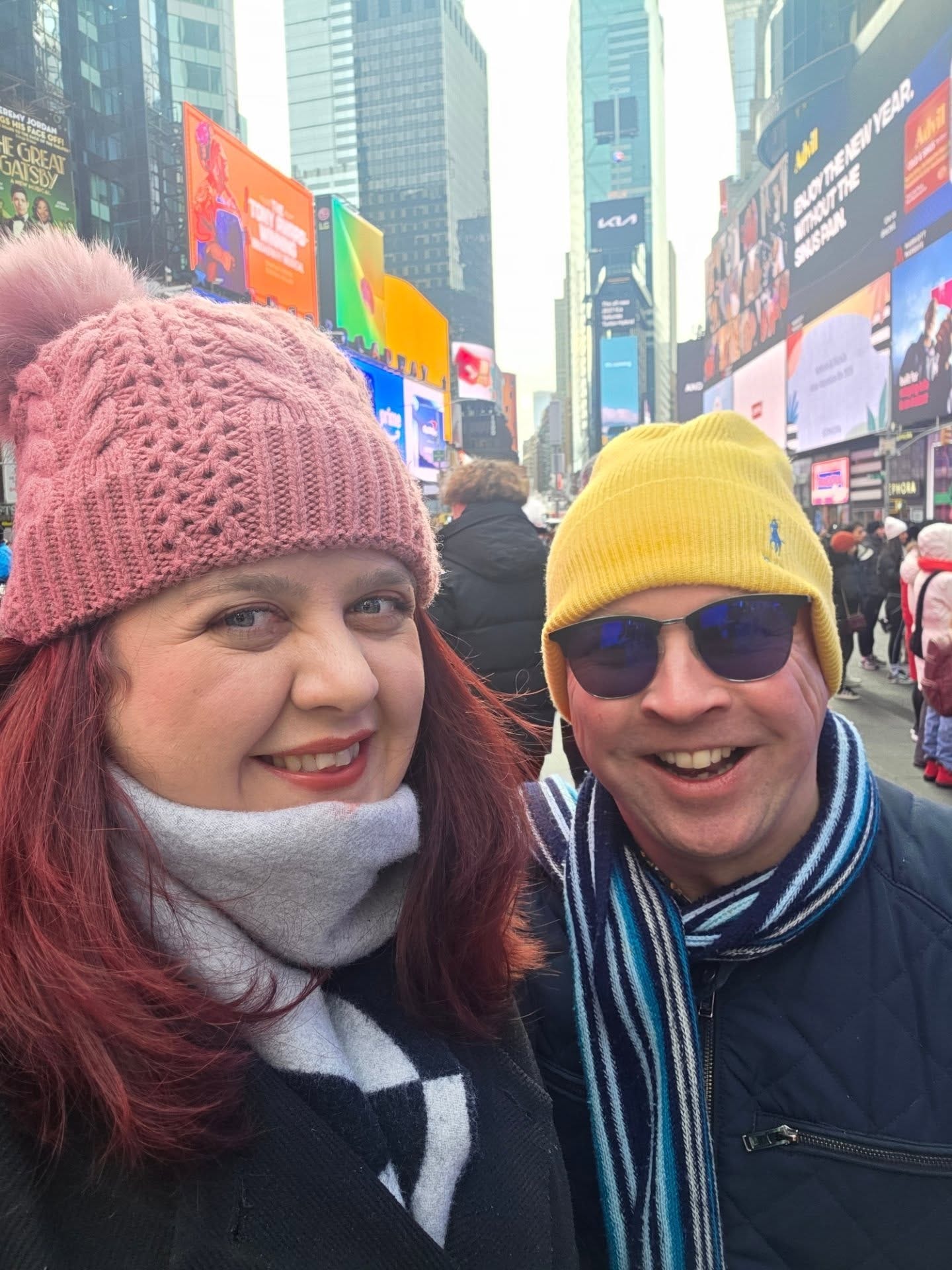 May be an image of Times Square and text