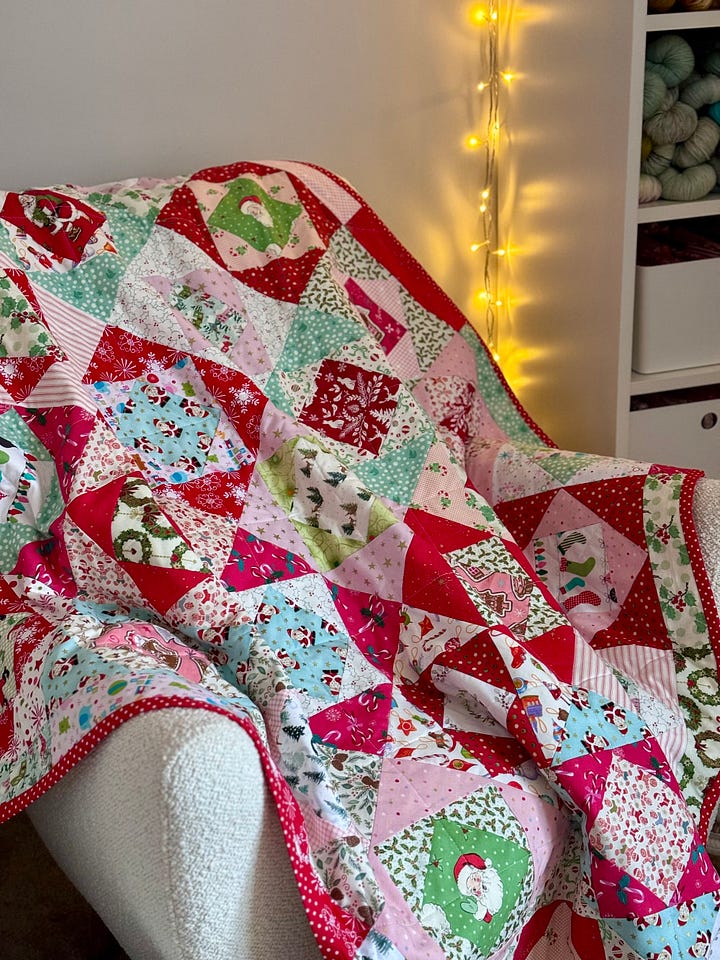 Handmade Christmas quilt in bright, merry fabrics!