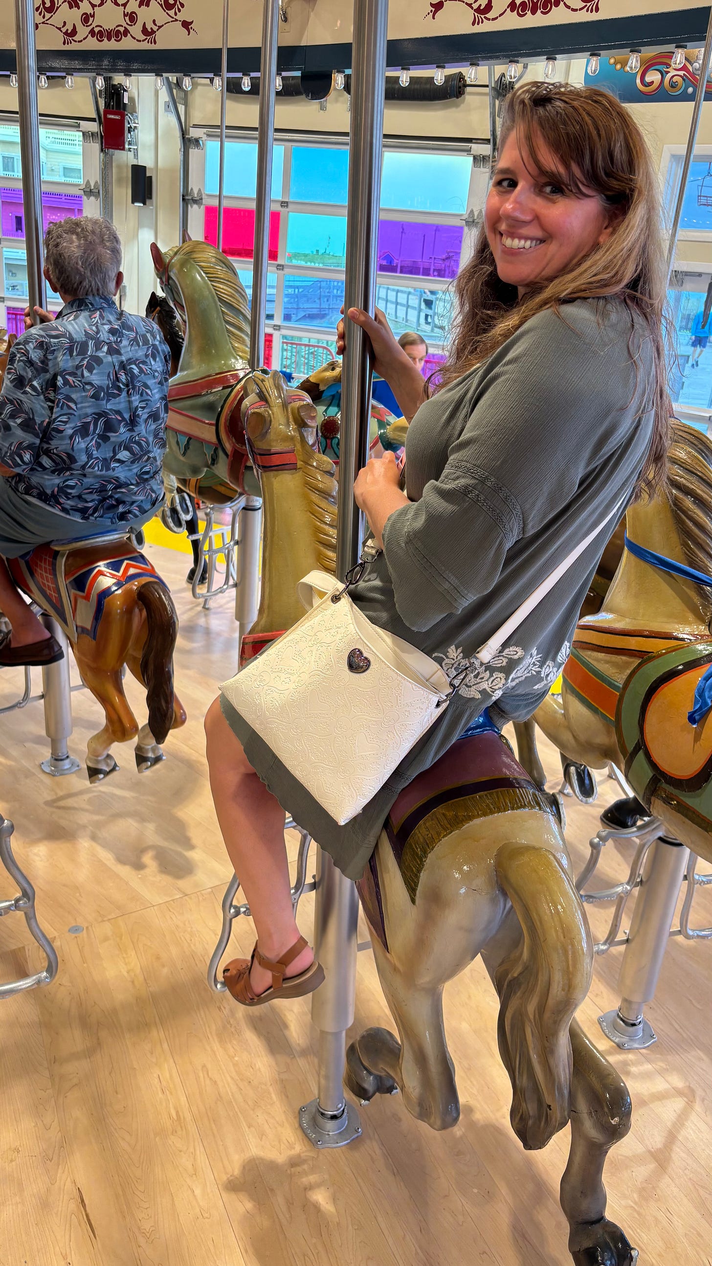 Photo of the author on a carousel horse.