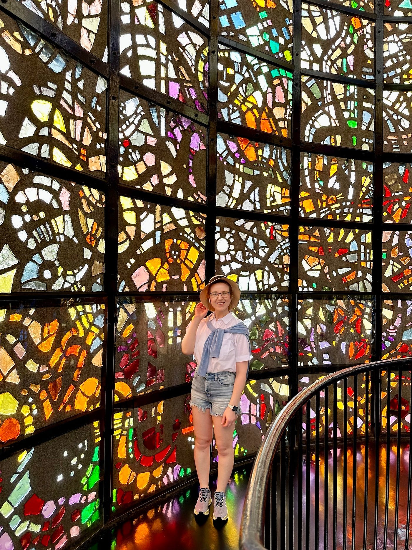 Mari-Alina Timoshchuk in the Symphonic Sculpture with a background of stained glass