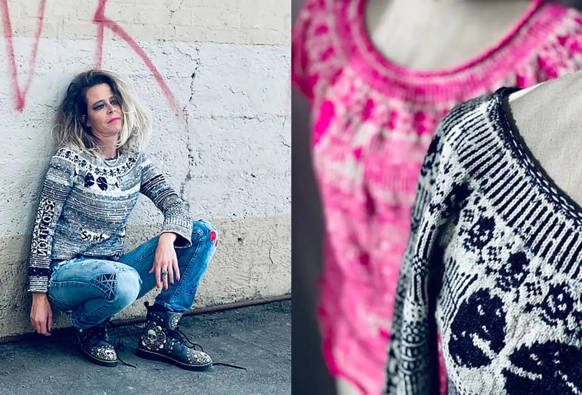 woman wearing a colorwork sweater, destroyed jeans and combat boots crouched with her back to a grafittied wall