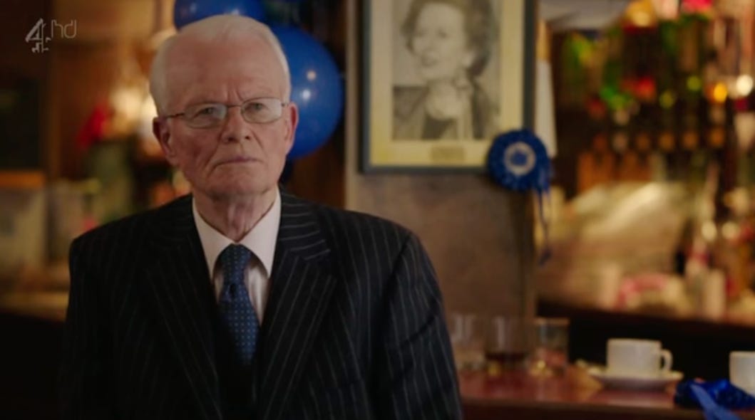 A person in a suit and tie

AI-generated content may be incorrect.