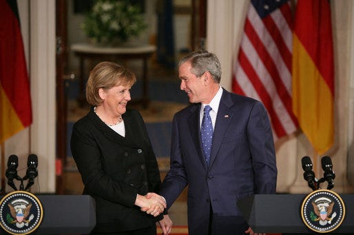 Photos of Angela Merkel, chancellor of German, dressed in blazers of various colors, speaking at a podium and shaking the hands of world leaders 