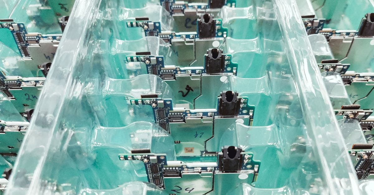 Photo: Andrey Matveev / Pexels Detailed view of organized electronic circuit boards in a production setting.