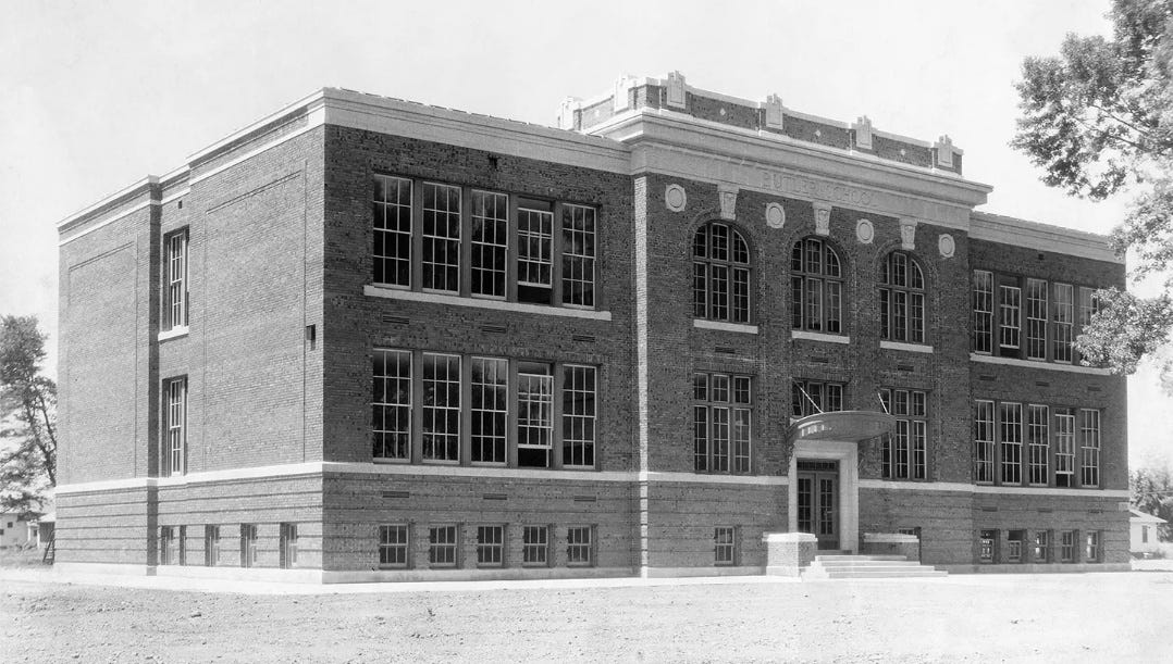 A black and white photo of a building

AI-generated content may be incorrect.