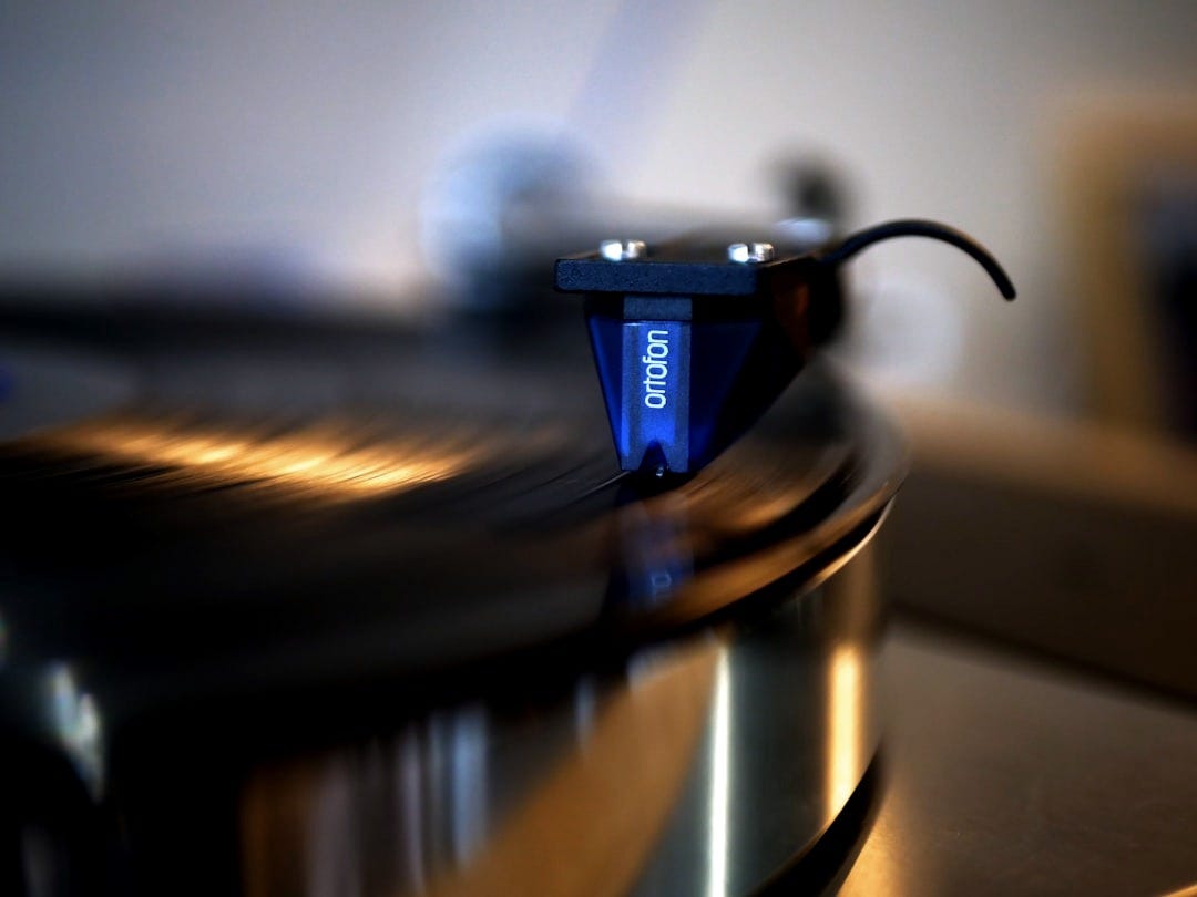 blue and silver coffee cup on stainless steel round tray
