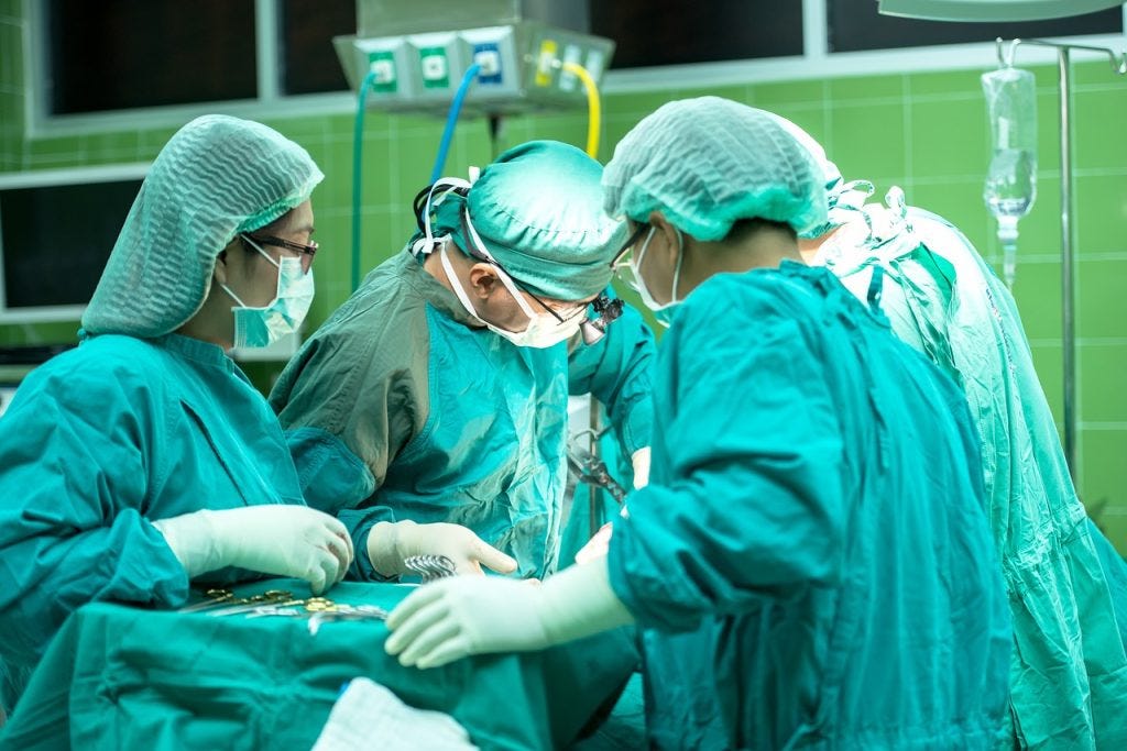 Tranq dope can lead to amputation by this group of surgeons surrounding a patient on an operating table Tranq dope can lead to amputation by this group of surgeons surrounding a patient on an operating table