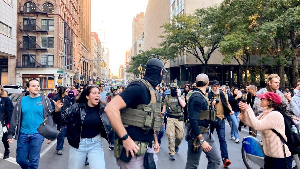 Photo: APnews.com Bystanders confront federal agents targeting street vendors on NYC’s Canal St. October 21