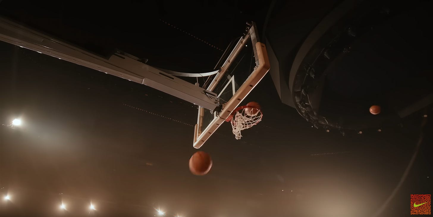 3 basketballs entering basketball hoop one after the other