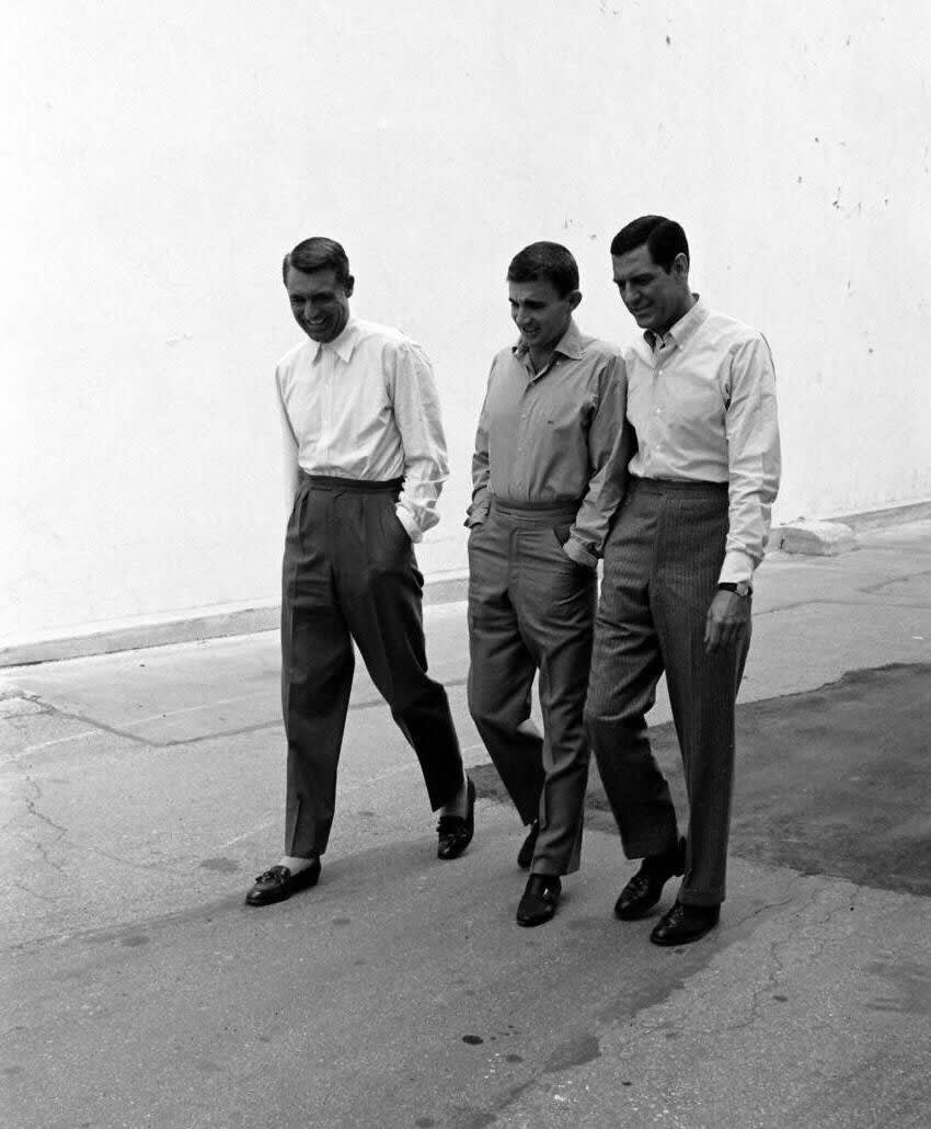 Cary Grant walking with two unknown men, c. 1950s – @archiesleach on Tumblr Cary Grant walking with two unknown men, c. 1950s – @archiesleach on Tumblr