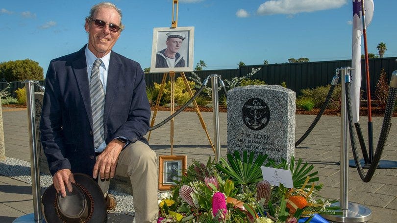 Colin Clark, nephew of Thomas Welsby Clark, kneels next to the re-dedicated headstone in honour of his uncle, who was last year revealed as the HMAS Sydney II's unknown sailor. Colin Clark, nephew of Thomas Welsby Clark, kneels next to the re-dedicated headstone in honour of his uncle, who was last year revealed as the HMAS Sydney II's unknown sailor.