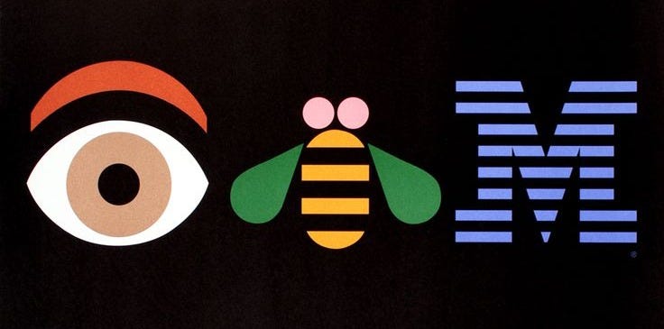 This may contain: the ibm logo with an eye and a bee on it's back side, in front of a black background