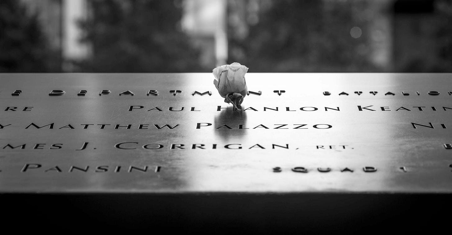 A single white rose placed among the engraved names at a reflecting pool at the National September 11 Memorial. A single white rose placed among the engraved names at a reflecting pool at the National September 11 Memorial.
