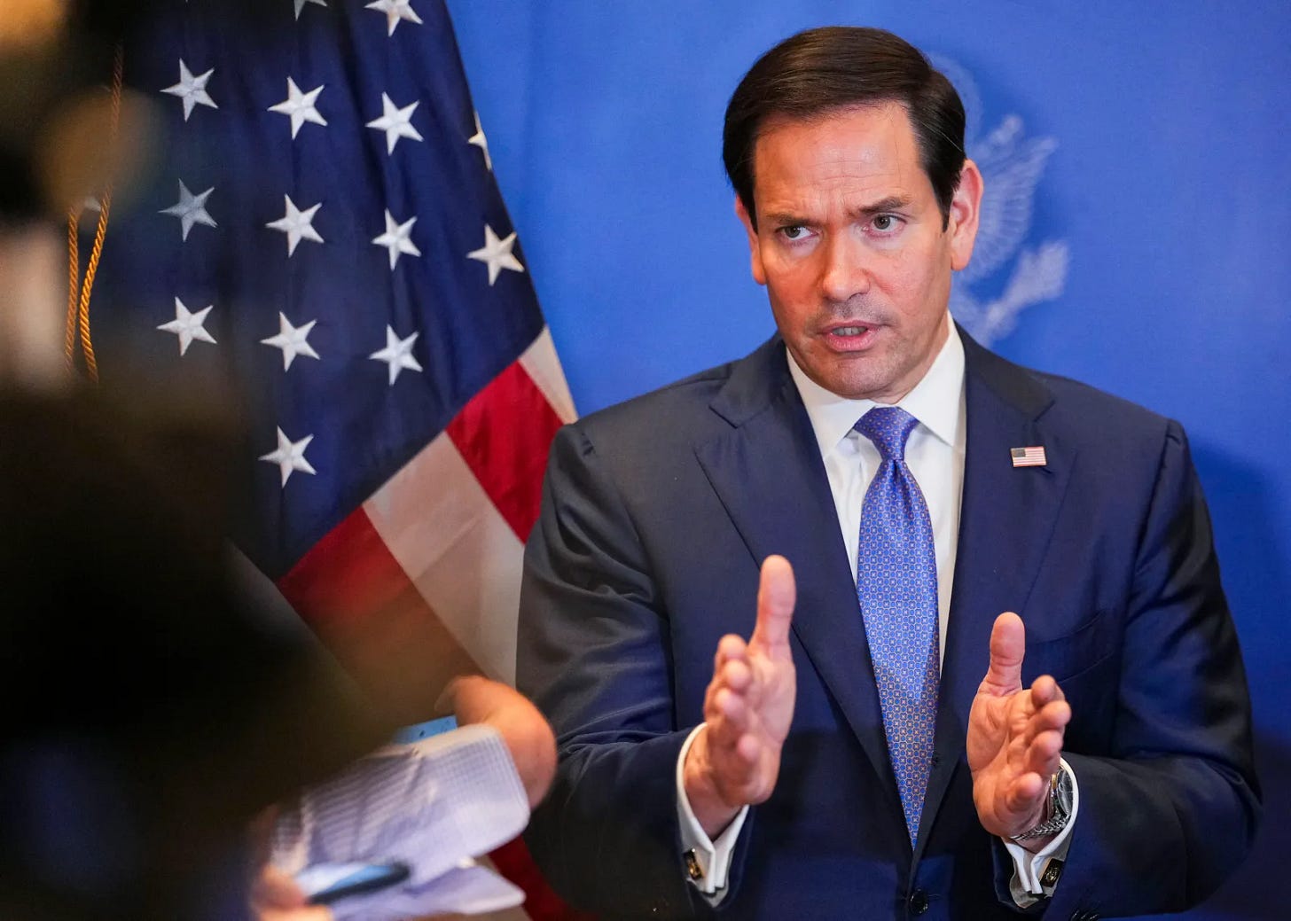 U.S. Secretary of State Marco Rubio speaks with the media before departing from Bahrain international airport on June 25, 2026.