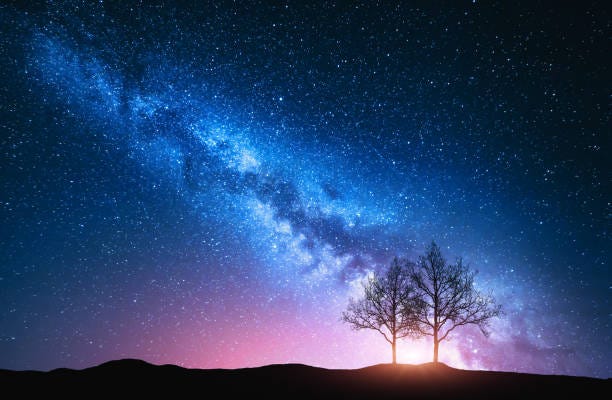 Starry Sky With Pink Milky Way And Trees Night Landscape With Alone Trees  On The Hill Against Colorful Milky Way Amazing Galaxy Nature Background  With Beautiful Universe Astrophotography Stock Photo - Download