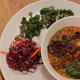 Squash and bean stew with shiitake bacon and charred scallion sauce (v)