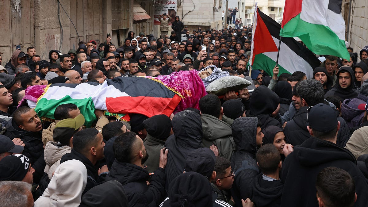 Large funeral for Palestinian youth killed by Israeli troops in West Bank; Two GOP senators join calls for Kristi Noem's resignation; Ilhan Omar attacked at town hall