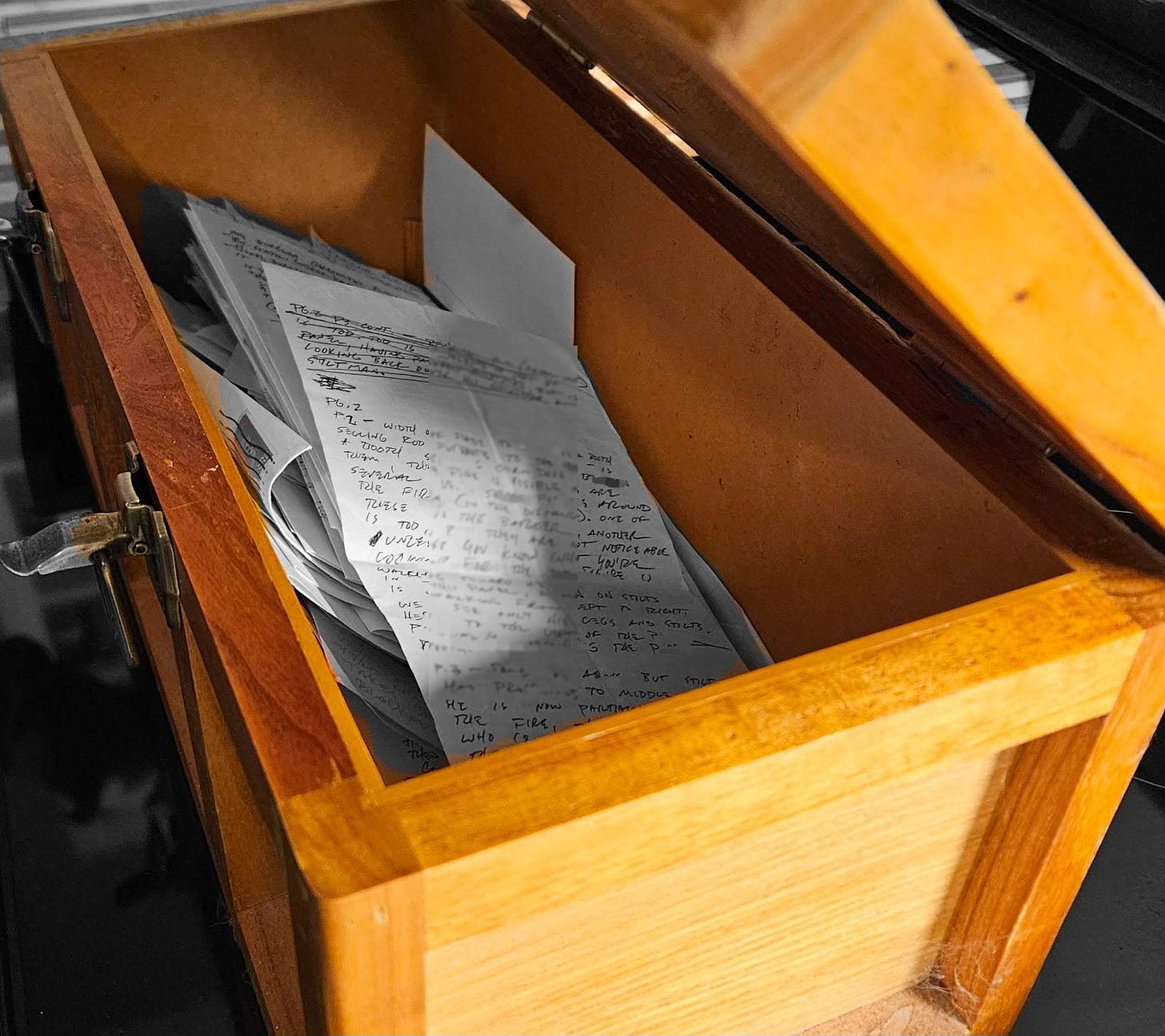 Open toolbox filled with scraps of paper.