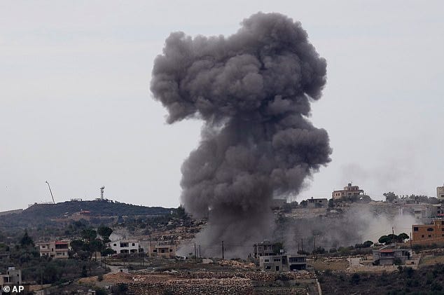 Black smoke rises from an Israeli airstrike on the outskirts of Aita al-Shaab, a Lebanese border village with Israel in south Lebanon, Monday, Nov. 13, 2023