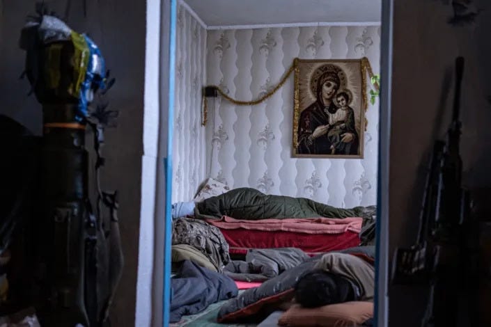 Men sleep as they recover from fighting in Ukraine after Russia&#x002019;s invasion.