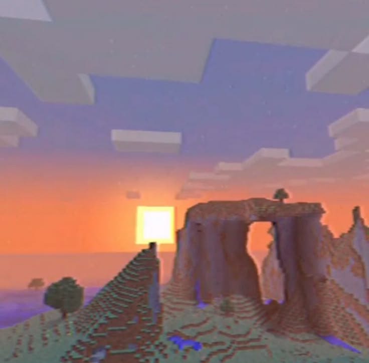 This may contain: the sun is setting over some rocks and mountains in this minecraft landscape scene,