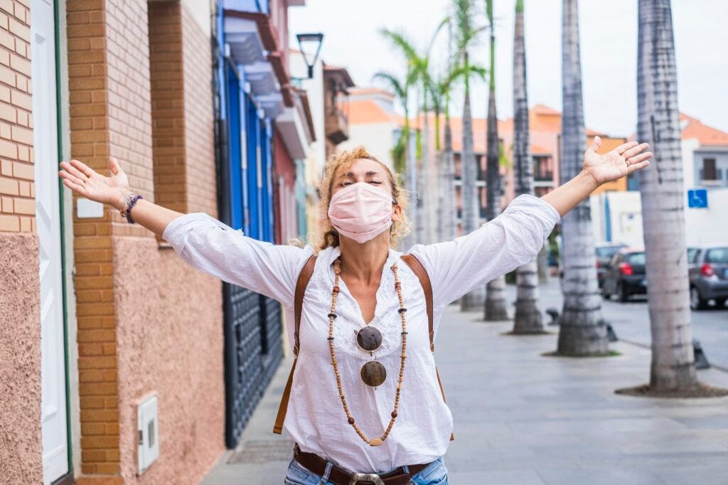 Happy woman celebrate the end of the pandemic emergency