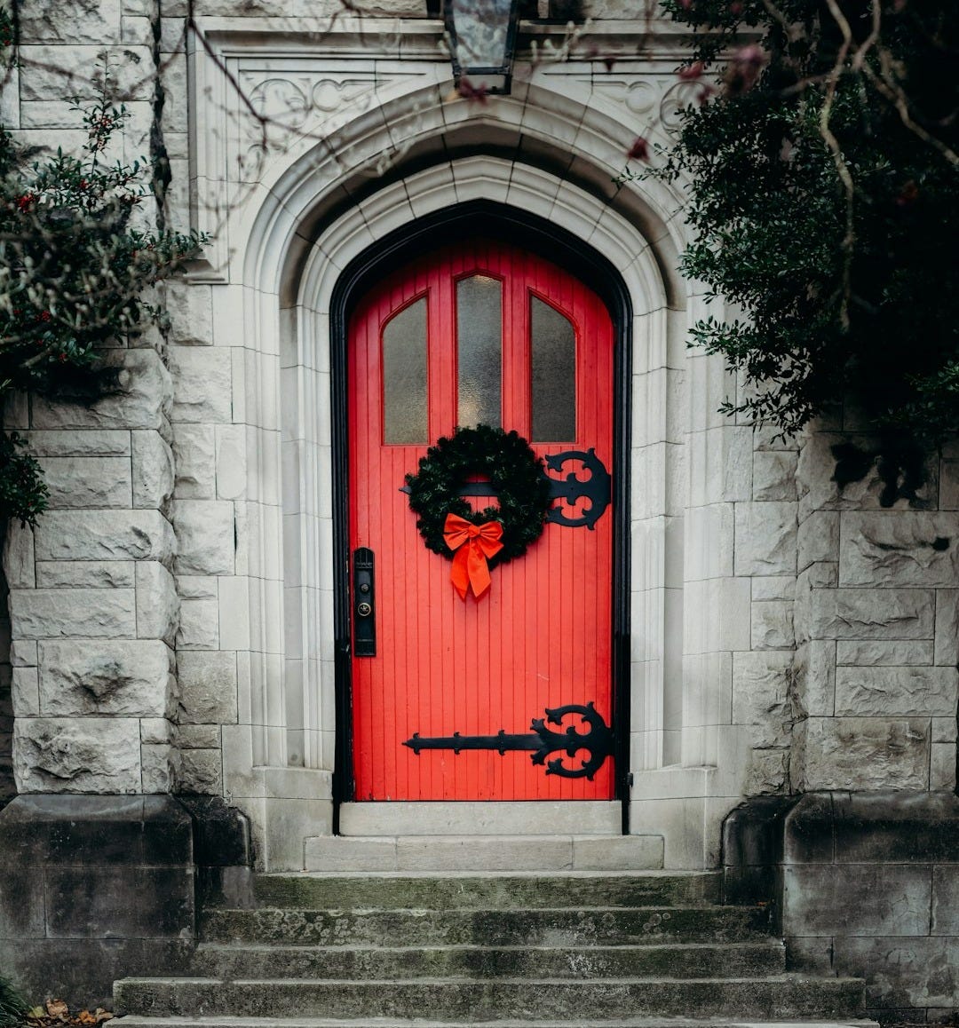 close-up photo of red wooden door