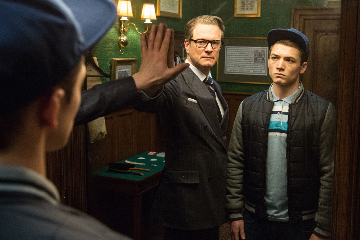This image may contain Clothing Apparel Human Person Taron Egerton Overcoat Coat and Suit