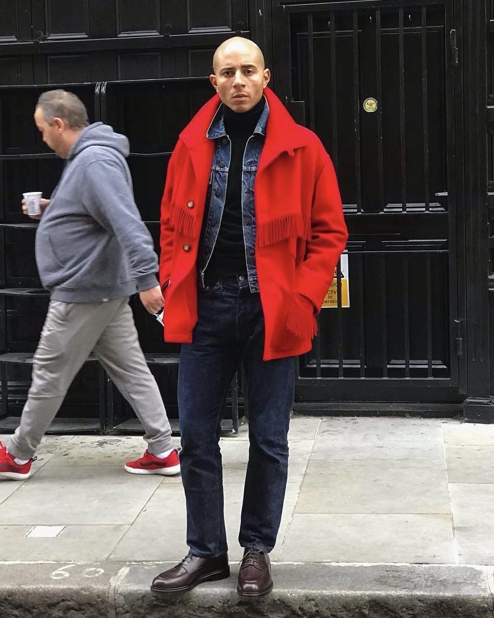 A person in a red coat

Description automatically generated