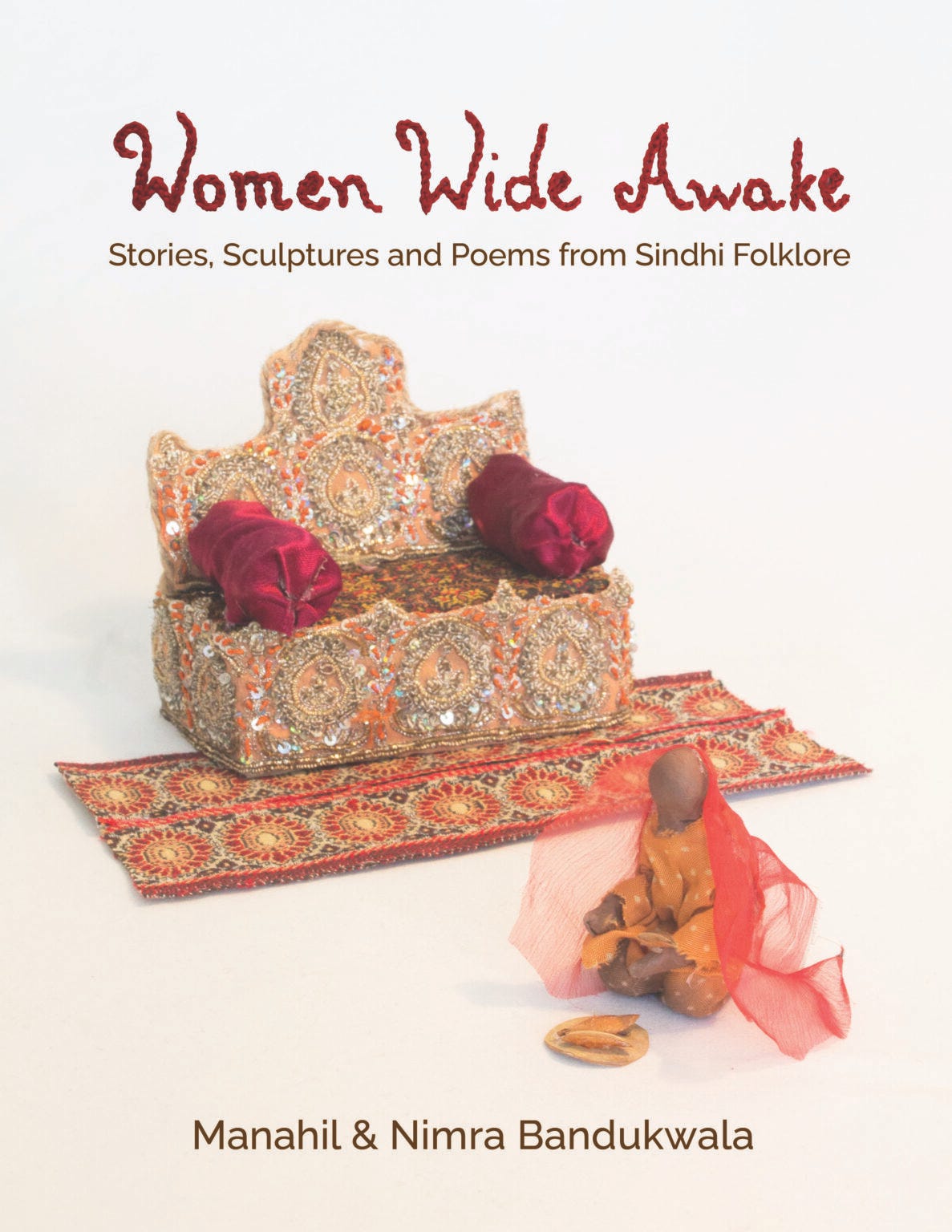 Text: Women Wide Awake (in embroidery); subtitle: Stories, Sculptures and Poems from Sindhi Folkore Text: Women Wide Awake (in embroidery); subtitle: Stories, Sculptures and Poems from Sindhi Folkore