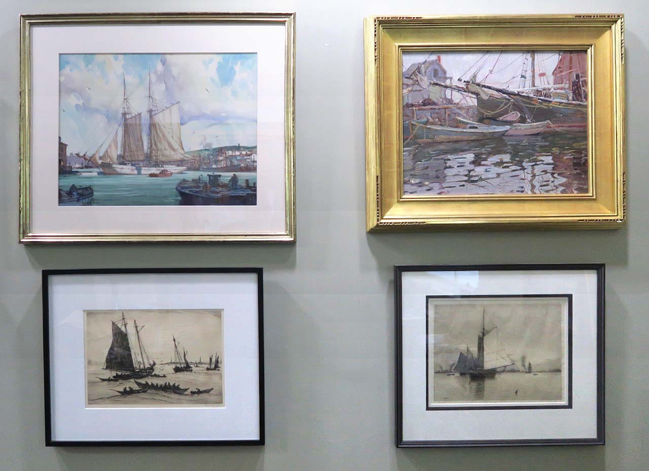 A group of framed pictures on a wall

Description automatically generated