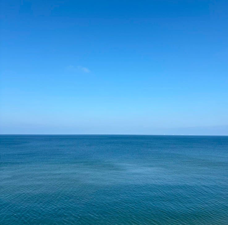Clear blue skies and sea. 