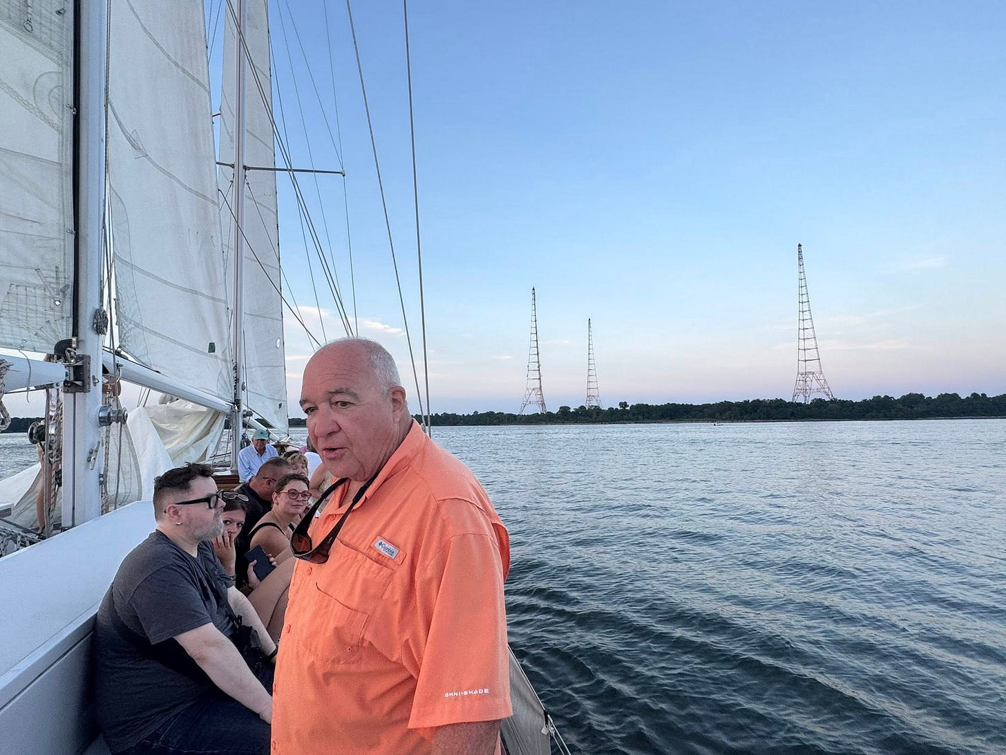 May be an image of 3 people, sailboat and sail