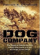 Gritty brown toned photo of U.S. Rangers running across a battlefield under enemy fire. The author’s name is across the top edge of the cover in black lettering. The title “DOG Company” is in bold military-style stencil font across the middle, in black with subtitle and author name in smaller type below in white lettering. The imagery and font evoke combat realism and grit.