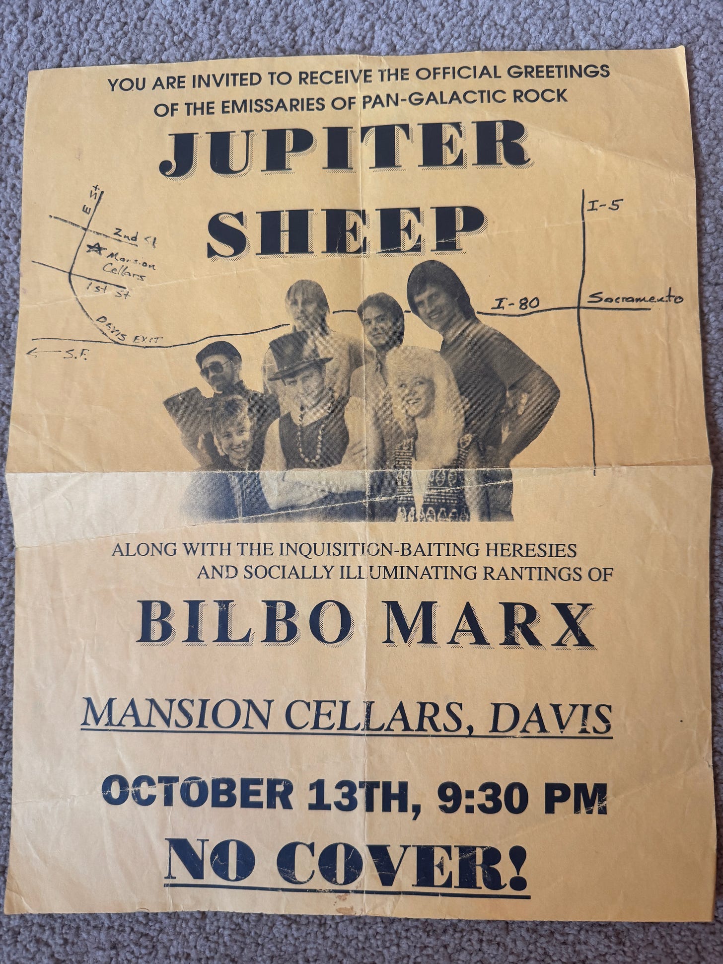 A yellowed handbill for Jupiter Sheep, ‘Emissaries of Pan-Galactic Rock,’ with Bilbo Marx, at Mansion Cellars in Davis, October 13th, 9:30 PM, no cover — a black-and-white band photo above a hand-drawn map to the venue. A yellowed handbill for Jupiter Sheep, ‘Emissaries of Pan-Galactic Rock,’ with Bilbo Marx, at Mansion Cellars in Davis, October 13th, 9:30 PM, no cover — a black-and-white band photo above a hand-drawn map to the venue.