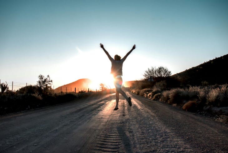 running free on the open road toward sunrise