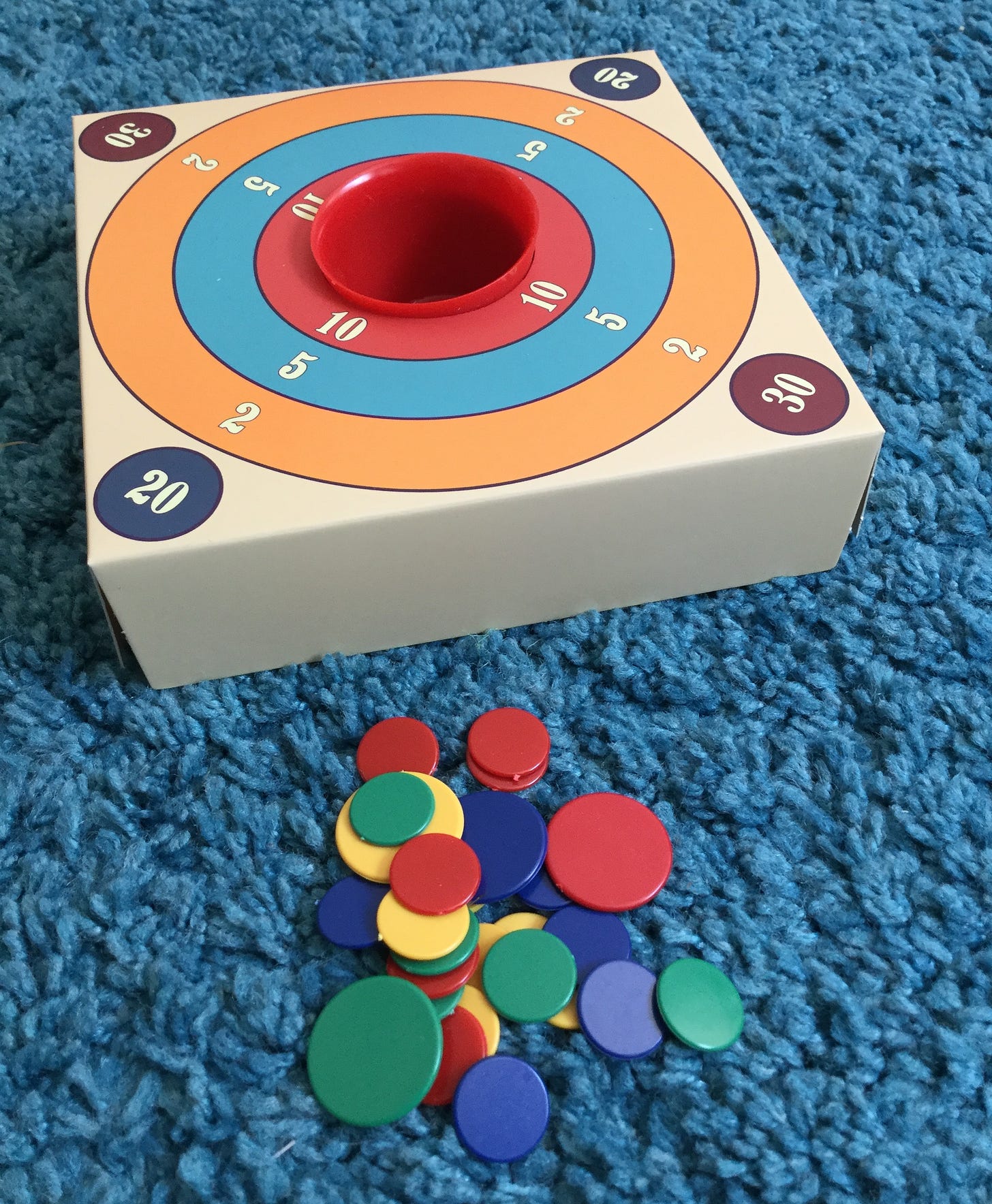 A game of Tiddlywinks set up to be played