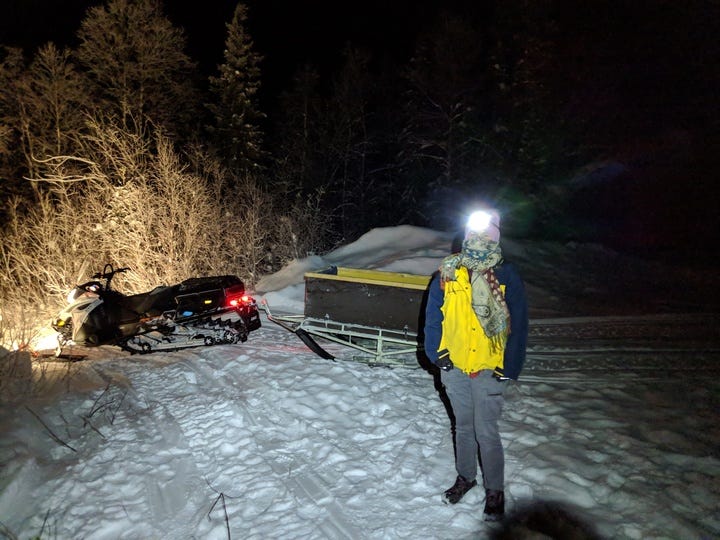 Renee wearing a headlamp in the dark.