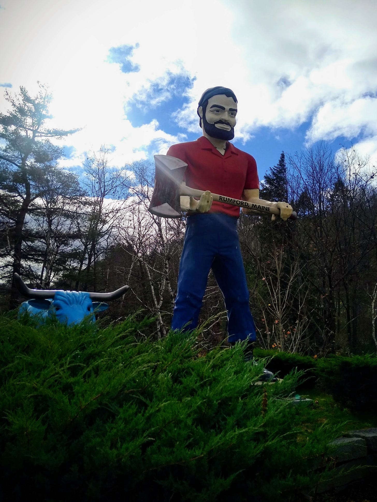 A colossal statue of Paul Bunyan holding a giant ax in Rumford Maine