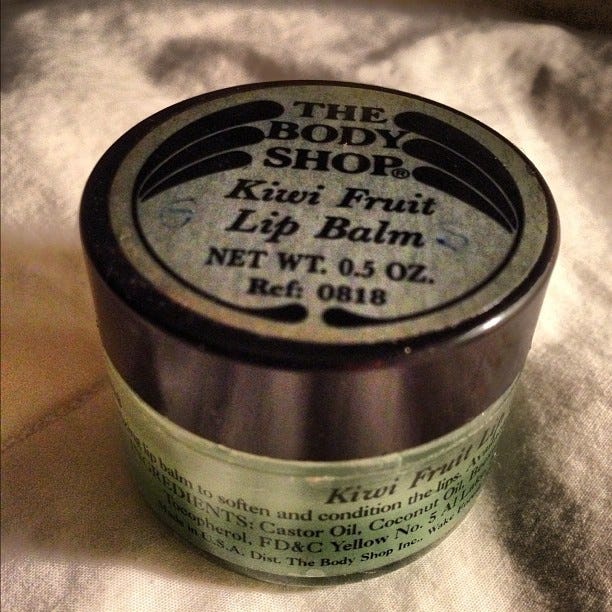 This may contain: the body shop kiwi fruit lip balm