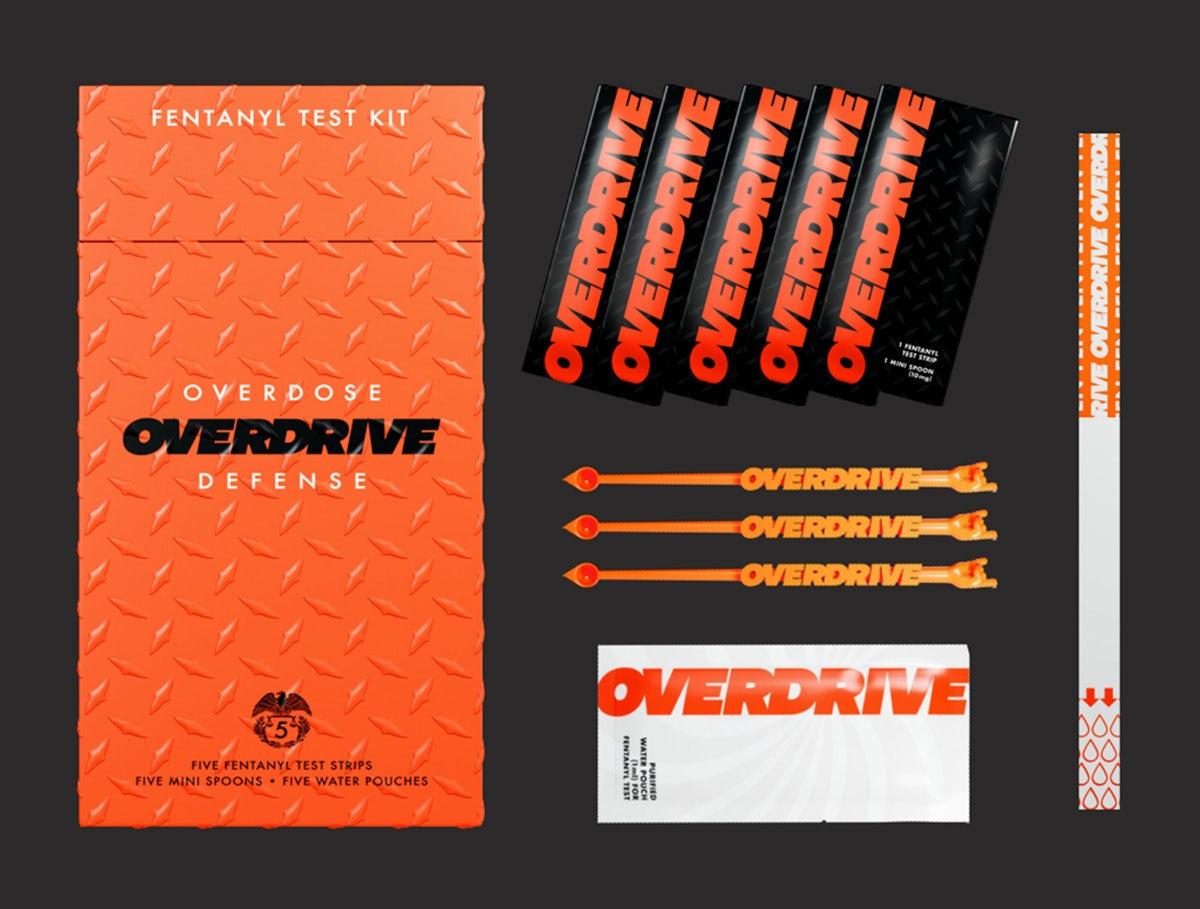 Overdrive drug test kits designed in bright orange packaging laid out flat on a dark background