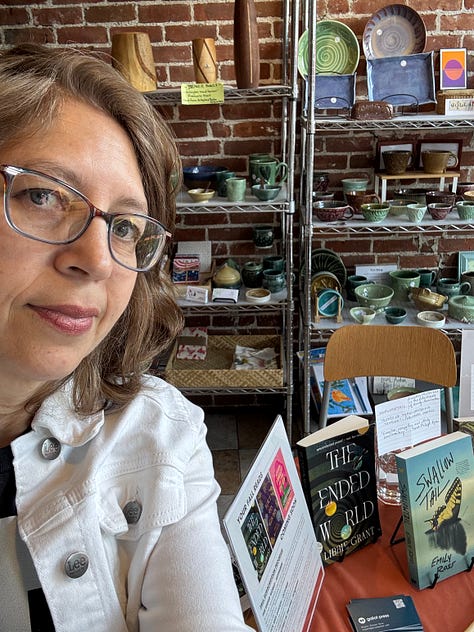 Images of Galiot Press books displayed on a table inside a café
