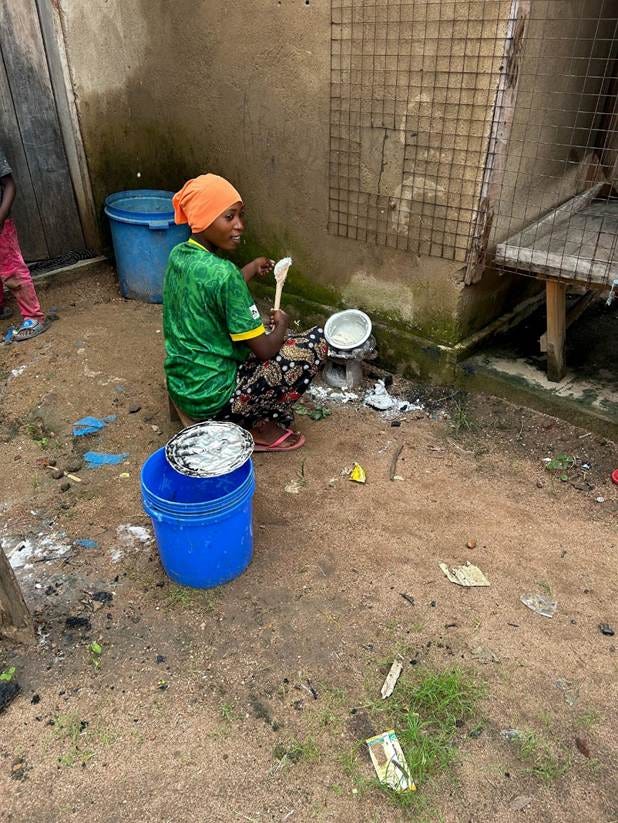 A person sitting outside with a bucket and a bucket

AI-generated content may be incorrect.