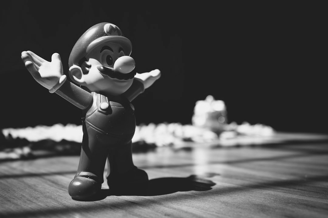 Super Mario figurine on brown surface Super Mario figurine on brown surface